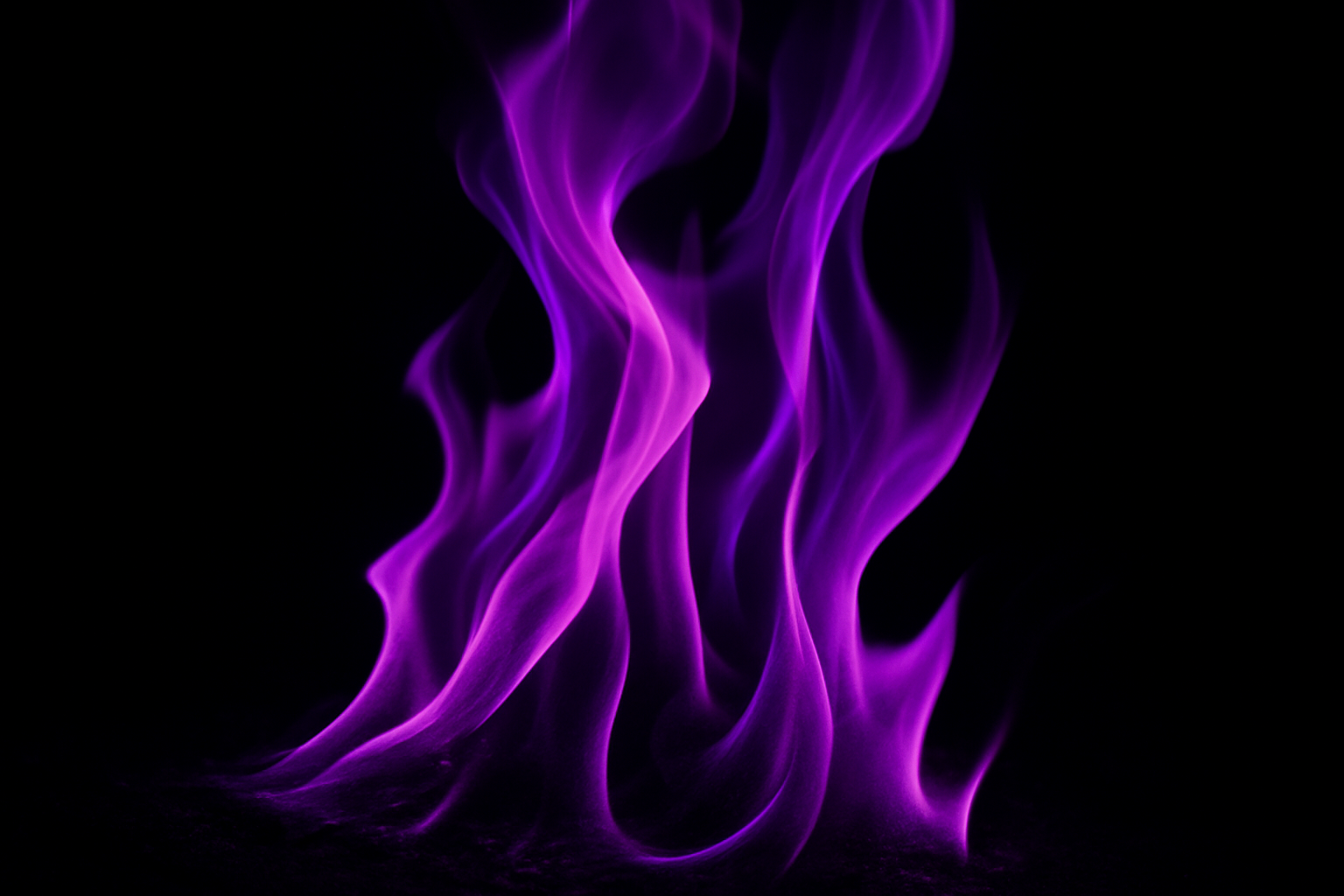 Give me a picture of a strong purple flame on a very close closeup 